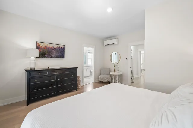 a bathroom with a granite countertop sink mirror and shower