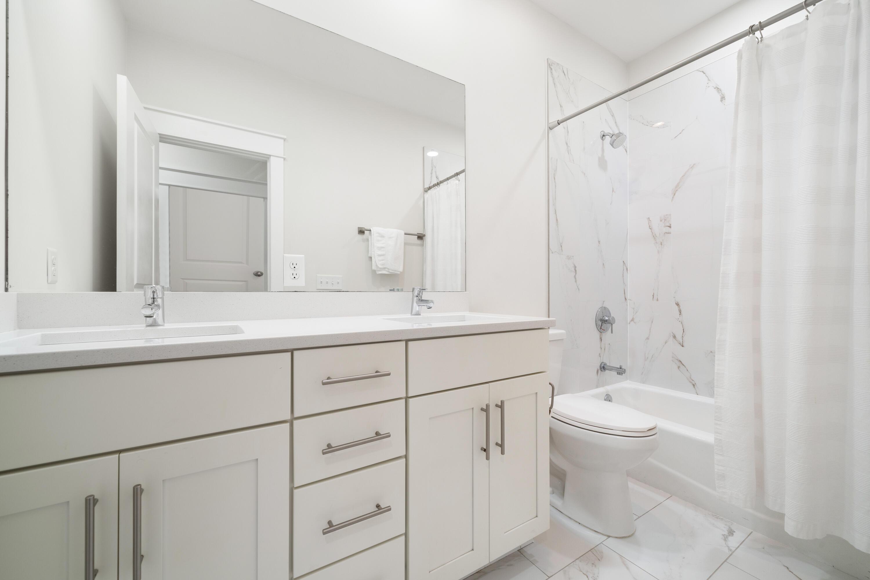 97 Beach View Drive Inlet Beach, FL 32461 - Photo 40 of 57 a bathroom with double vanity sink a mirror and a toilet