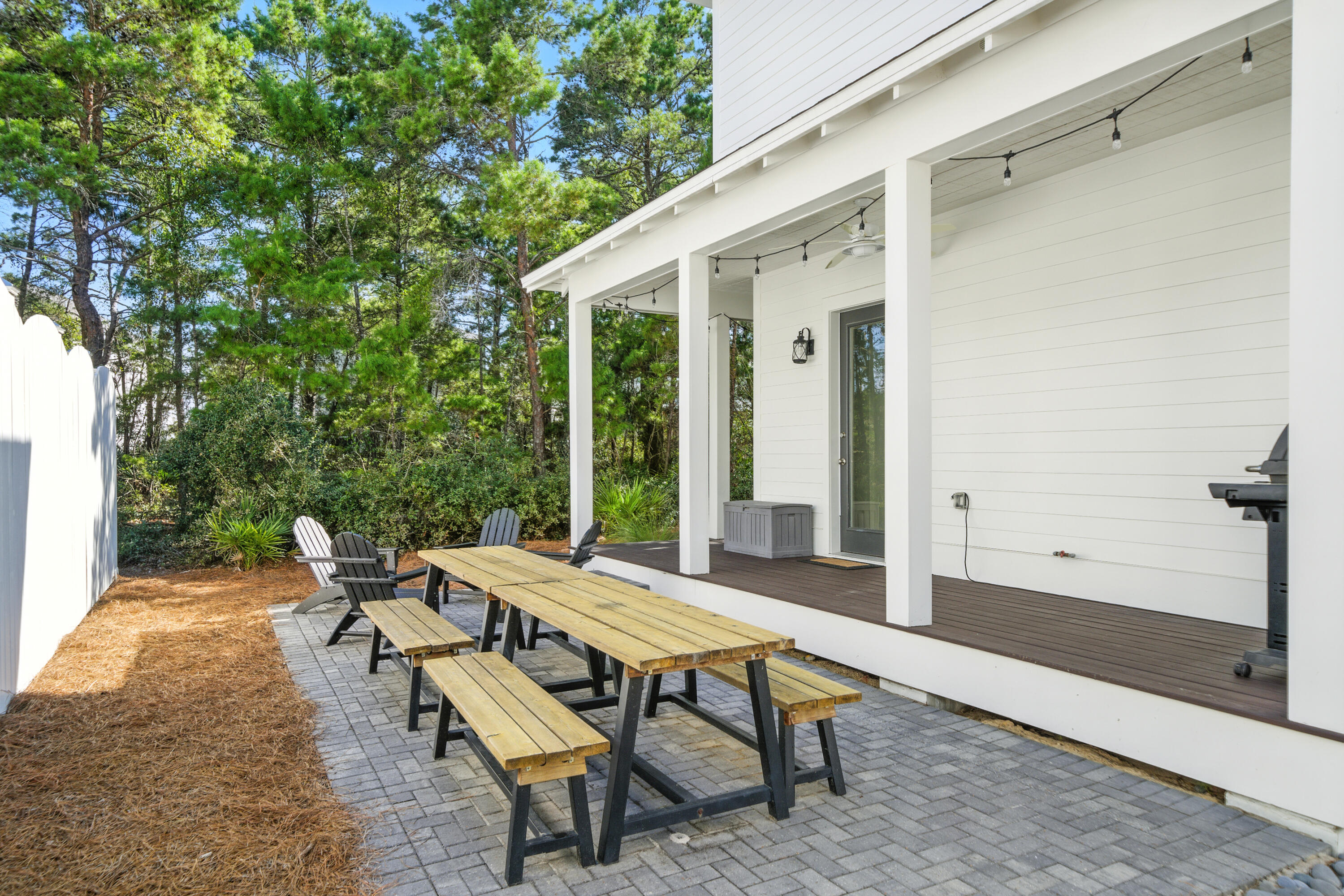 97 Beach View Drive Inlet Beach, FL 32461 - Photo 4 of 57 a backyard of a house with table and chairs