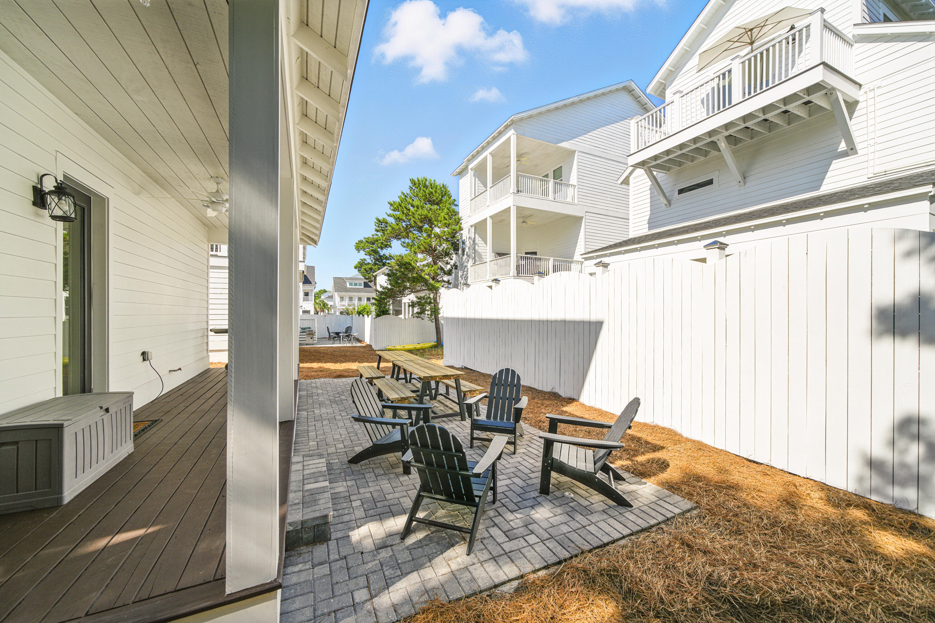 97 Beach View Drive Inlet Beach, FL 32461 - Photo 42 of 57 a view of a patio with table and chairs and potted plants
