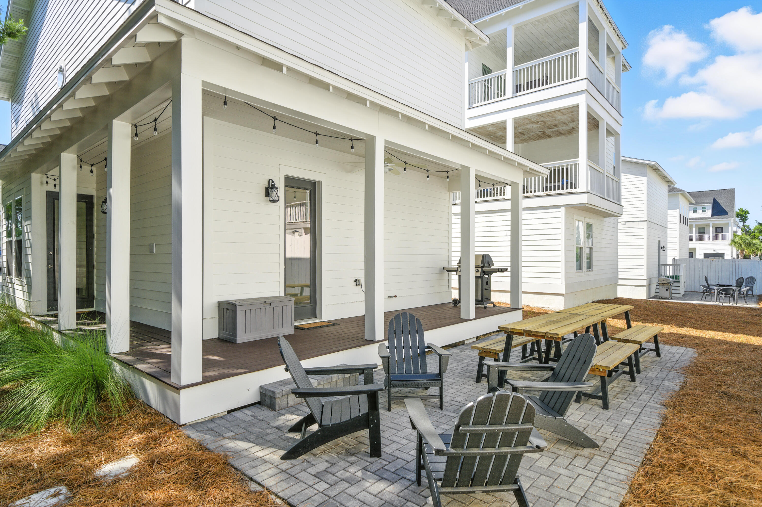 97 Beach View Drive Inlet Beach, FL 32461 - Photo 43 of 57 a view of a patio with couches table and chairs and potted plants