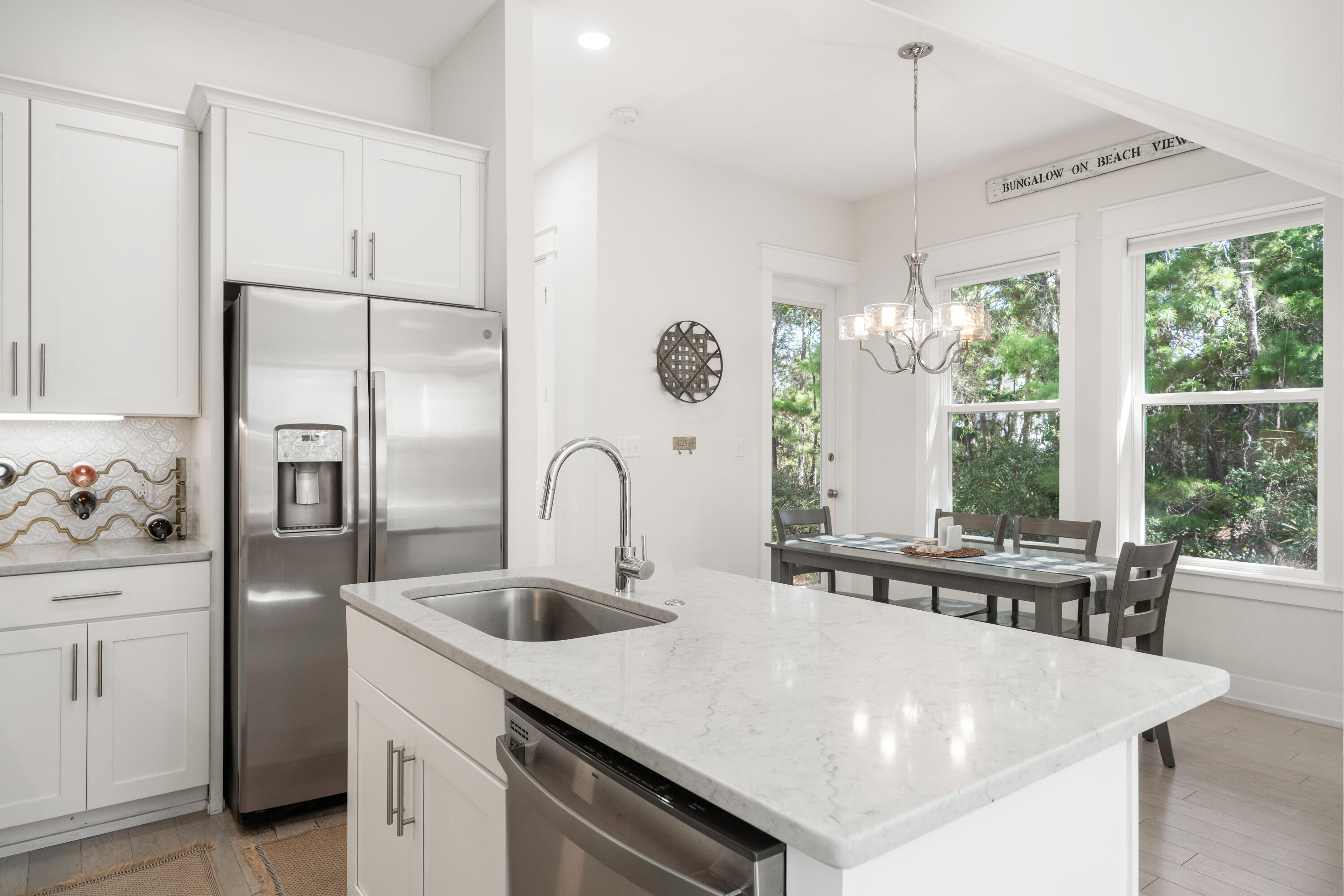 97 Beach View Drive Inlet Beach, FL 32461 - Photo 8 of 57 a kitchen with stainless steel appliances granite countertop a sink a stove and a refrigerator
