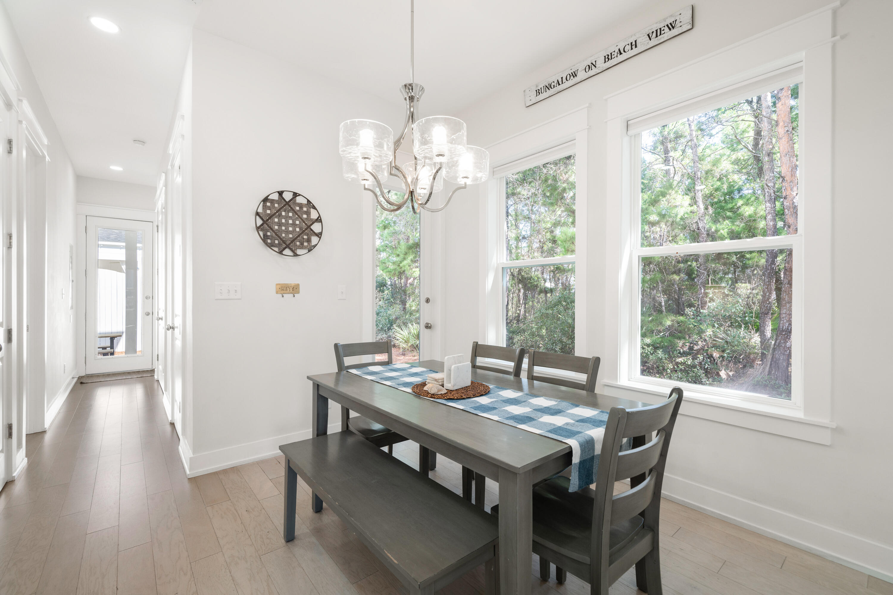 97 Beach View Drive Inlet Beach, FL 32461 - Photo 10 of 57 a view of a dining room with furniture wooden floor and chandelier