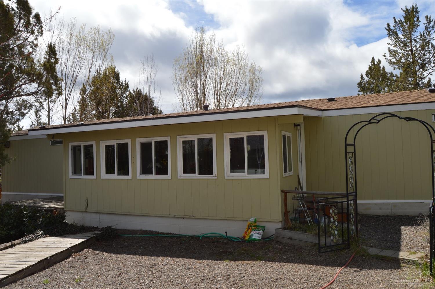 8280 Southwest Crater Loop Road Terrebonne, OR 97760 - Photo 21 of 25 This is the sunroom, with a wall of doub