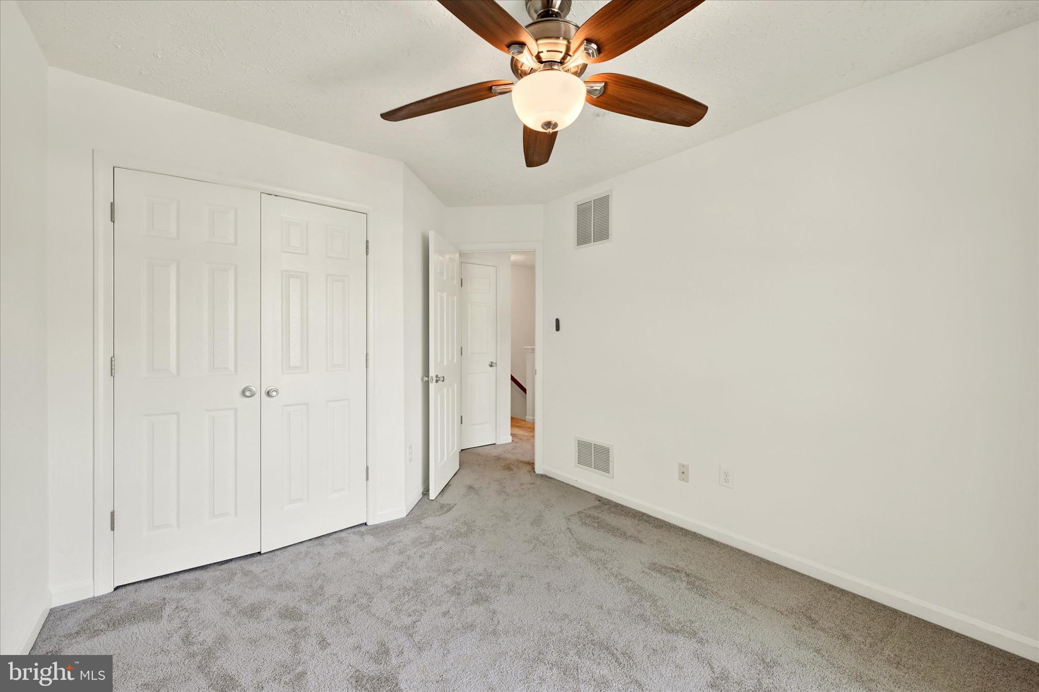 6119 Starburn Path Columbia, MD 21045 - Photo 13 of 28 an empty room with chandelier fan