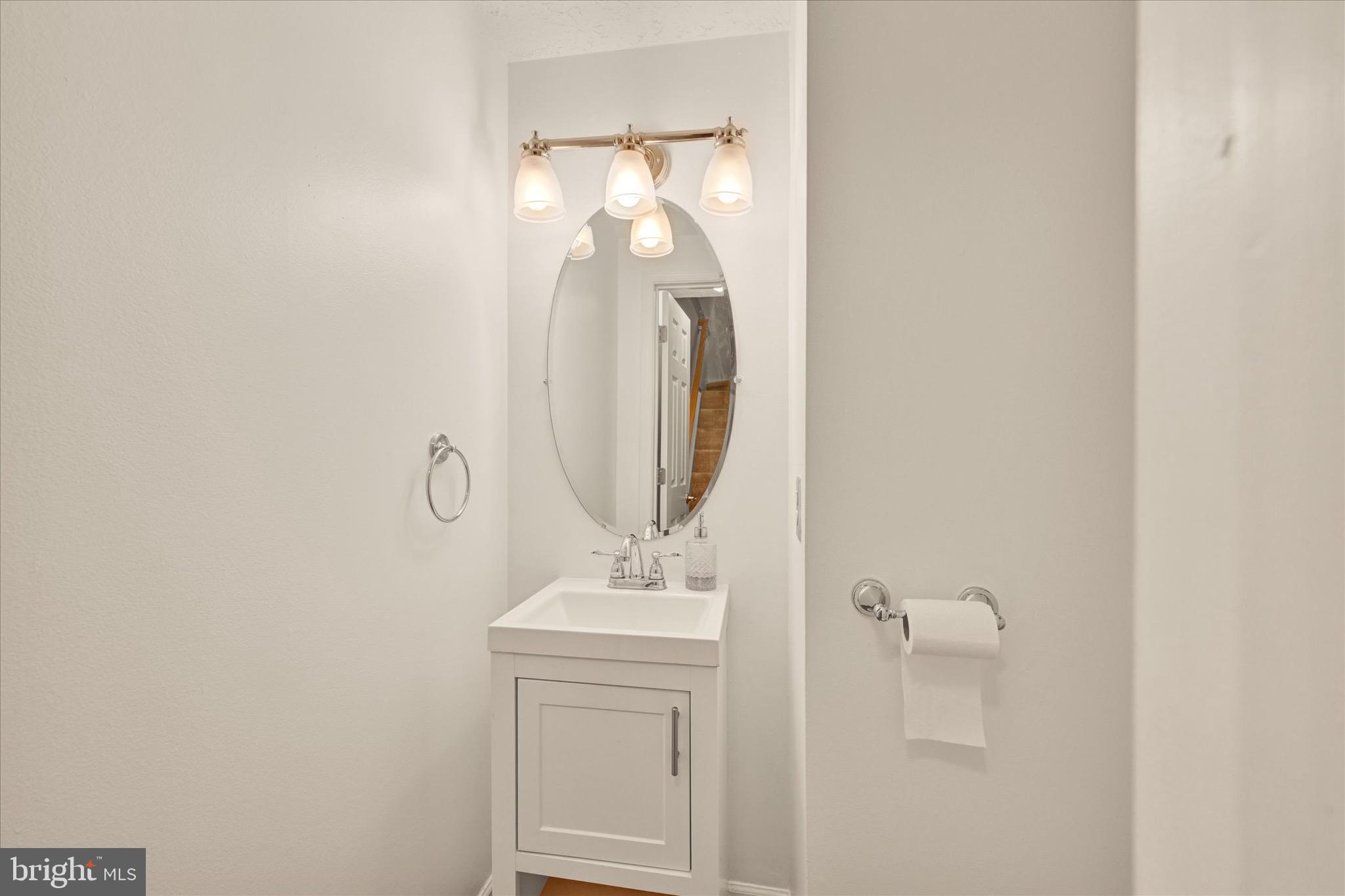 6119 Starburn Path Columbia, MD 21045 - Photo 14 of 28 a bathroom with a sink and a mirror