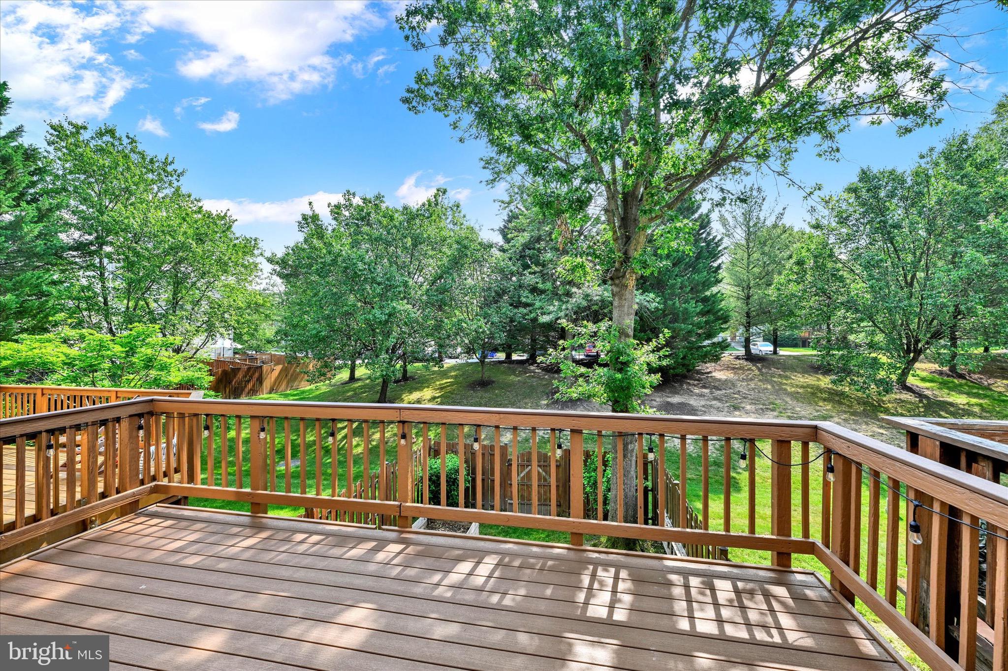 6119 Starburn Path Columbia, MD 21045 - Photo 24 of 28 a view of balcony with wooden floor and fence