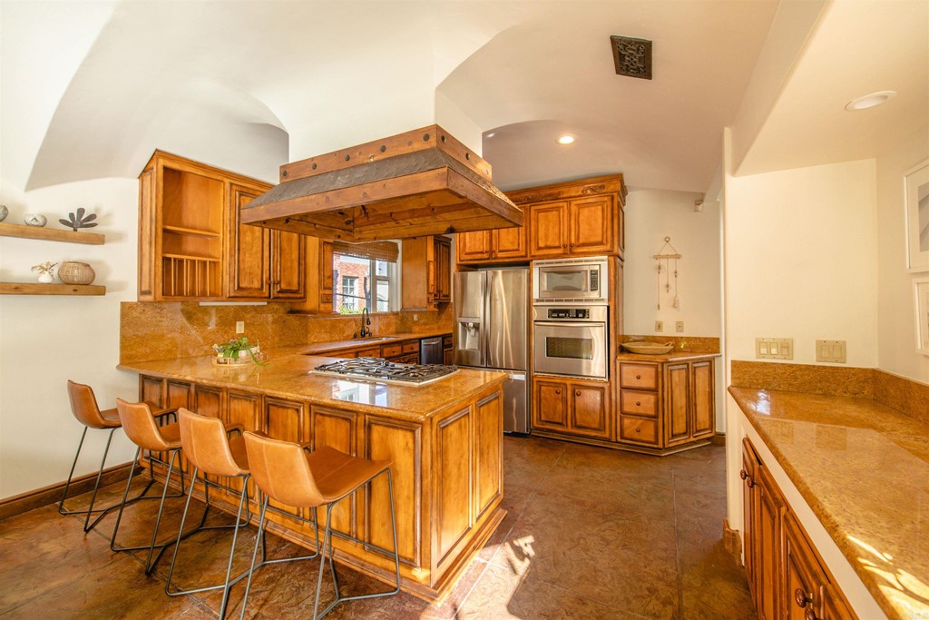 3209 James Drive Carlsbad, CA 92008 - Photo 11 of 65 a kitchen that has a stove and a table