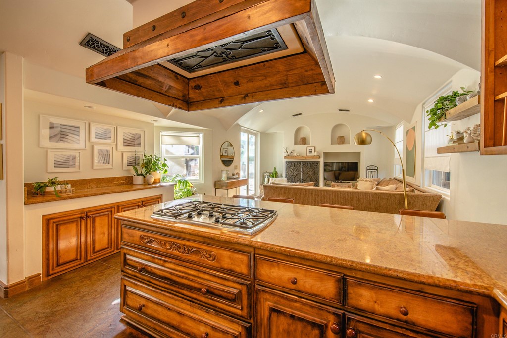 3209 James Drive Carlsbad, CA 92008 - Photo 16 of 65 a large kitchen with stainless steel appliances granite countertop a stove and a white cabinets