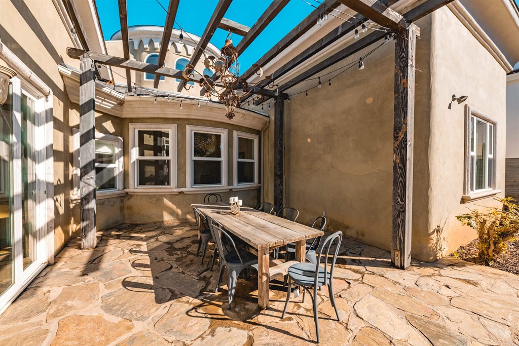 3209 James Drive Carlsbad, CA 92008 - Photo 3 of 65 a view of a patio with a table and chairs