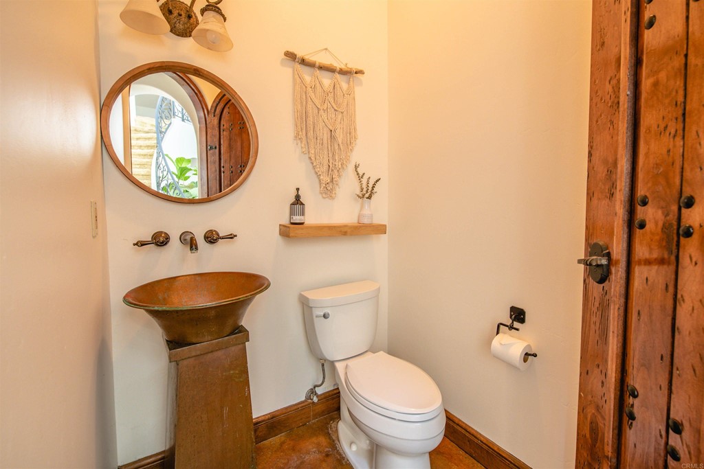 3209 James Drive Carlsbad, CA 92008 - Photo 21 of 65 a bathroom with a sink and a mirror