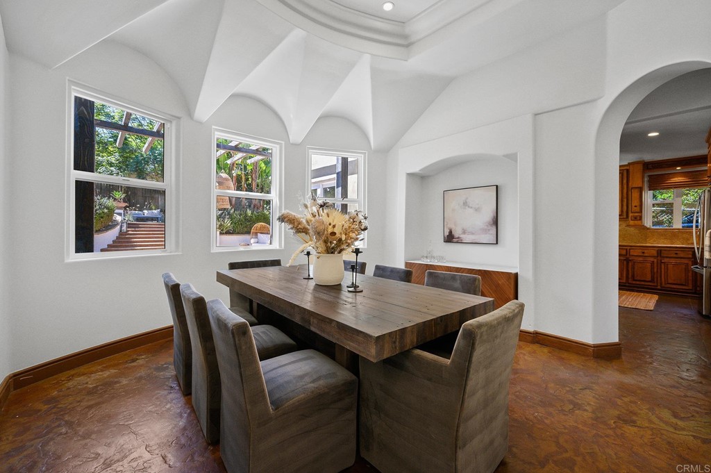 3209 James Drive Carlsbad, CA 92008 - Photo 22 of 65 a view of a dining room with furniture window and wooden floor