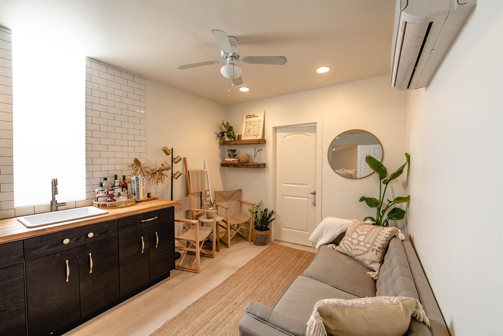 3209 James Drive Carlsbad, CA 92008 - Photo 39 of 65 a living room with furniture and a mirror