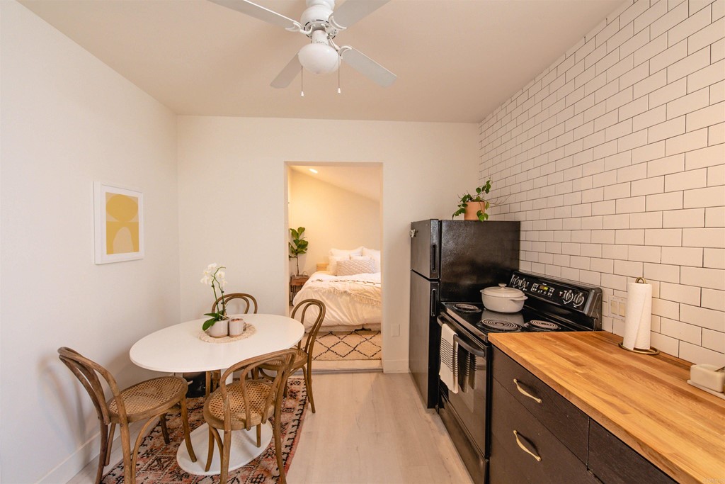 3209 James Drive Carlsbad, CA 92008 - Photo 40 of 65 a kitchen that has a table and chairs in it
