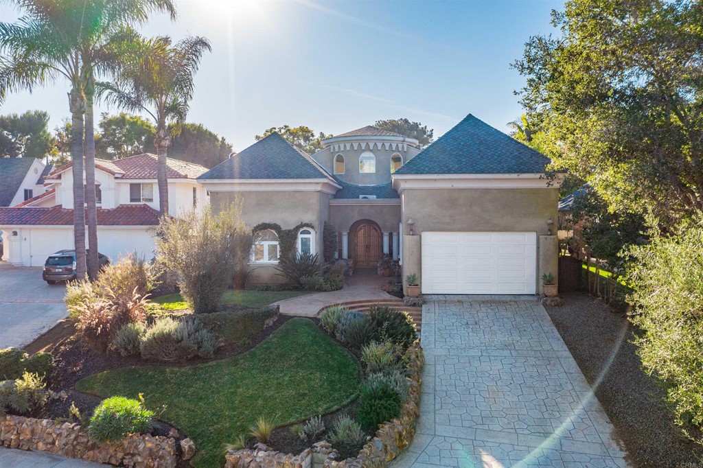 3209 James Drive Carlsbad, CA 92008 - Photo 57 of 65 a front view of a house with a yard and a garage