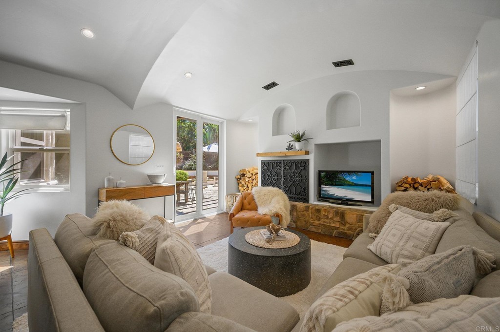 3209 James Drive Carlsbad, CA 92008 - Photo 8 of 65 a living room with furniture and a fireplace