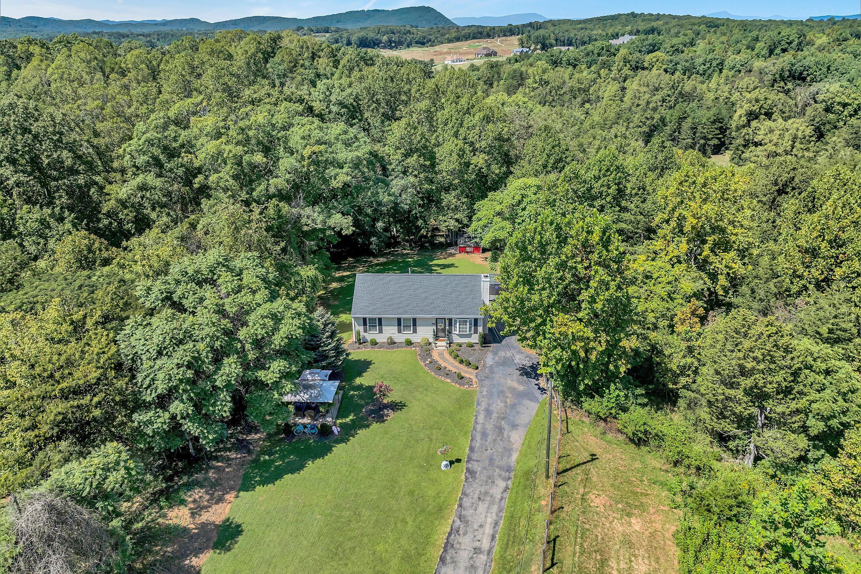 4070 Pitzer Road Roanoke, VA 24014 - Photo 1 of 25 an aerial view of a house with a yard
