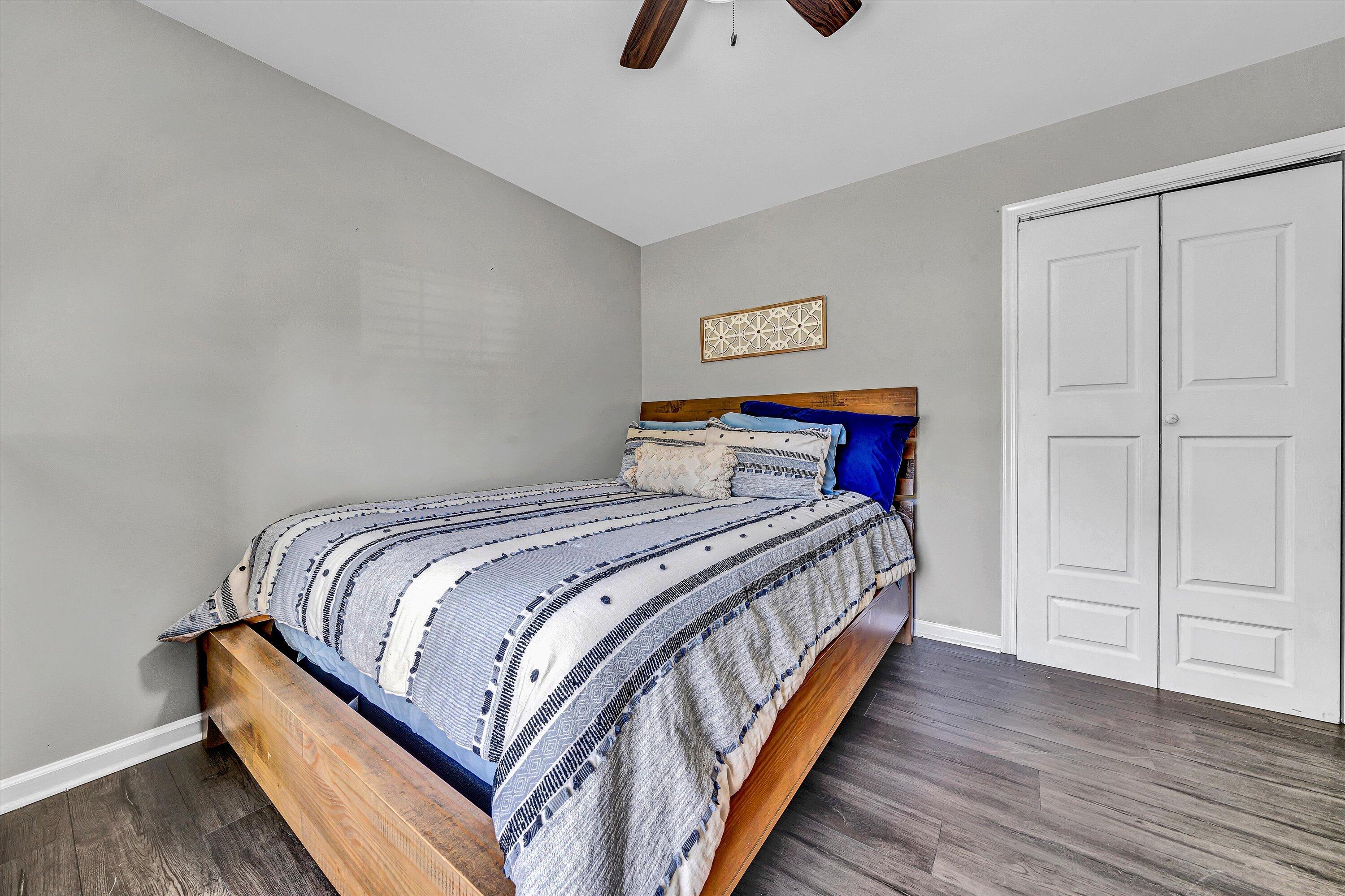 4070 Pitzer Road Roanoke, VA 24014 - Photo 13 of 25 a bedroom with a bed and wooden floor