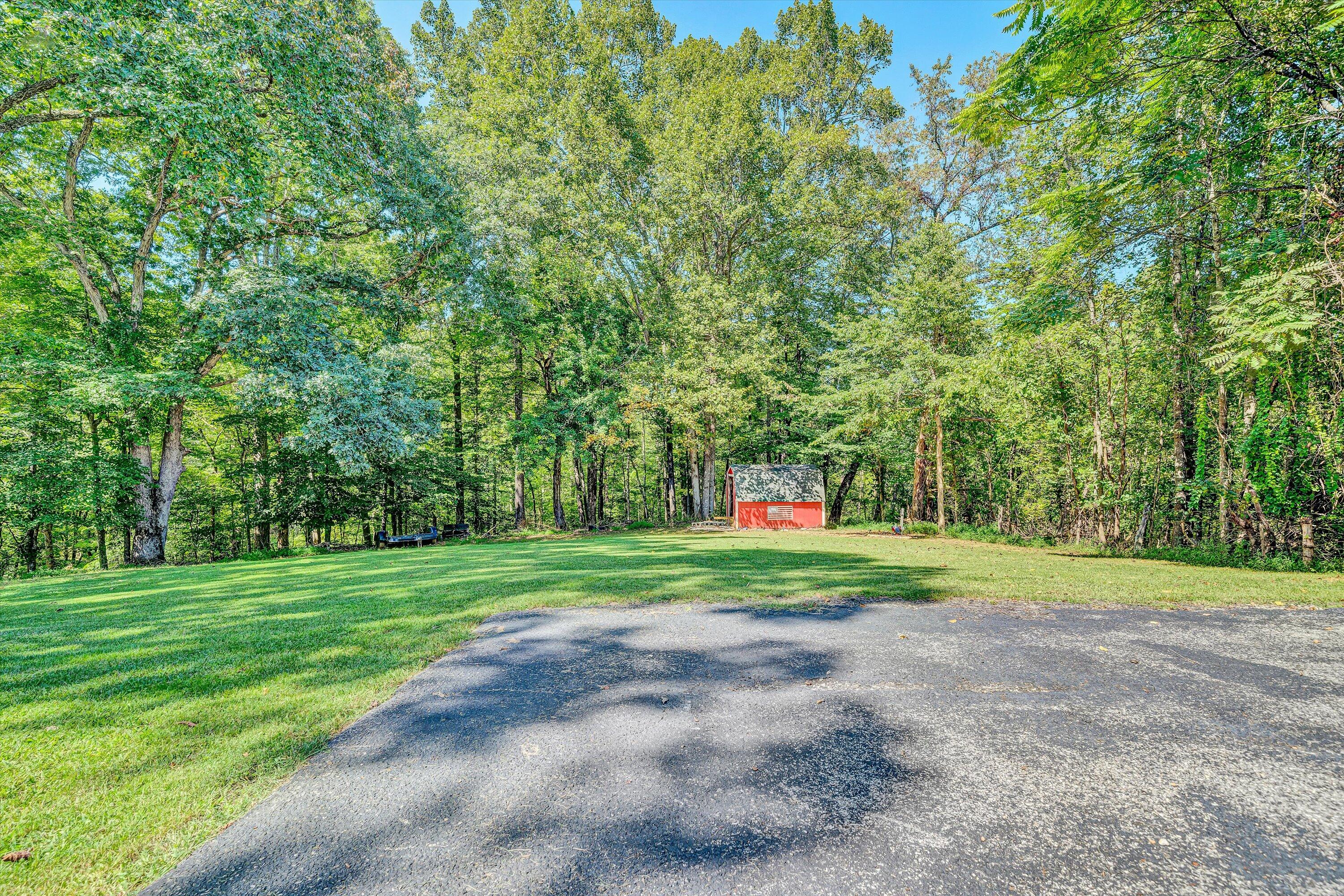 4070 Pitzer Road Roanoke, VA 24014 - Photo 22 of 25 a big yard with lots of green space and trees