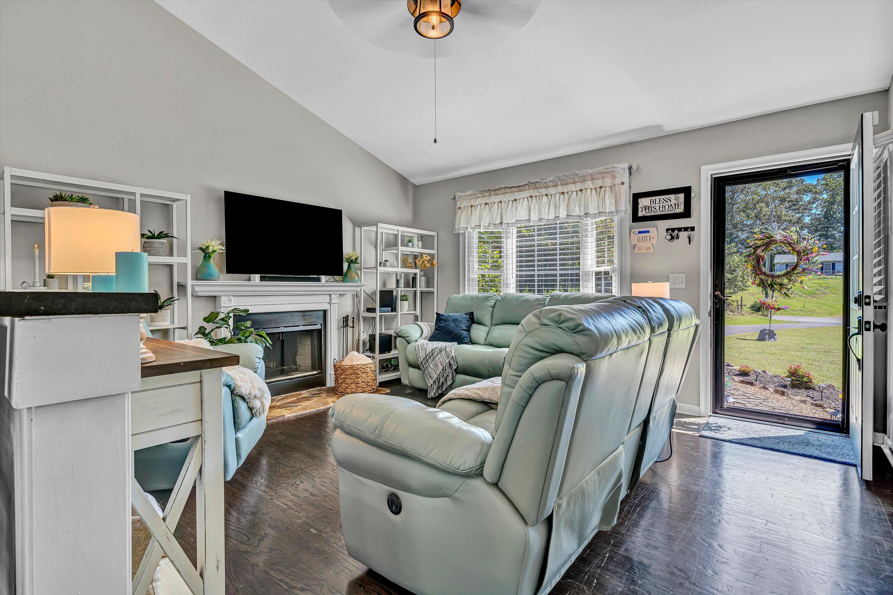 4070 Pitzer Road Roanoke, VA 24014 - Photo 4 of 25 a living room with furniture a flat screen tv and a fireplace