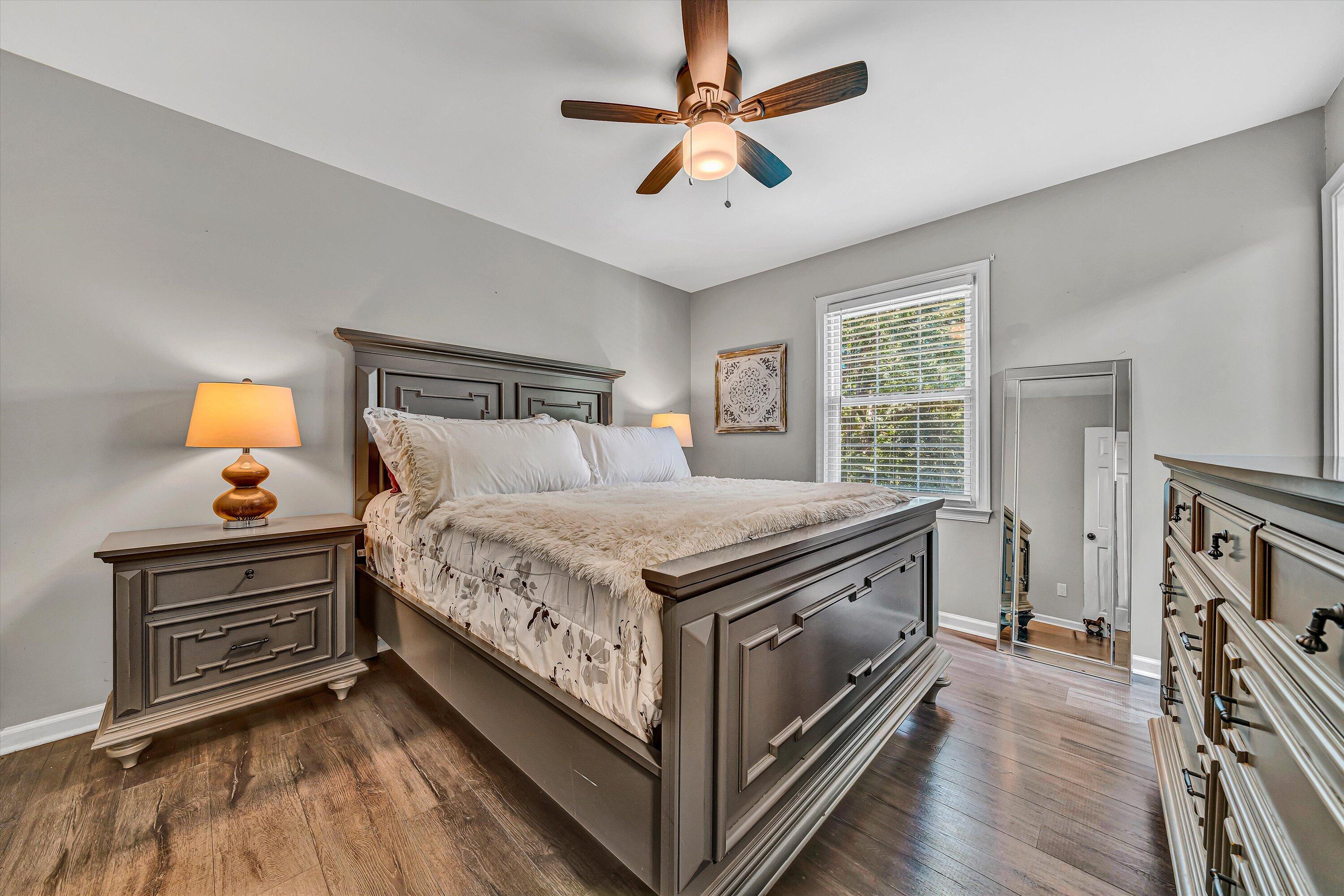 4070 Pitzer Road Roanoke, VA 24014 - Photo 9 of 25 a spacious bedroom with a bed and a chandelier