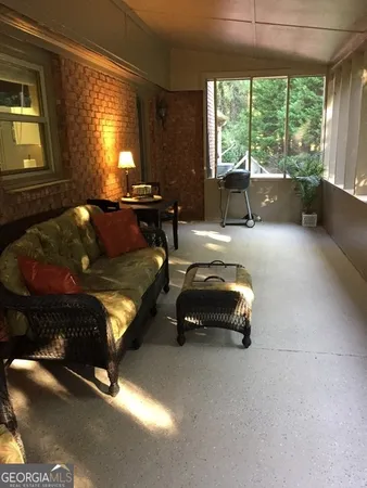 a bed room with a bed and a large window