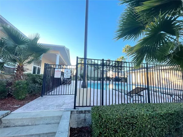 a view of a wrought iron fences in front of house