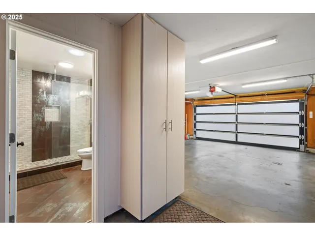 a view of wooden floor and windows in a room