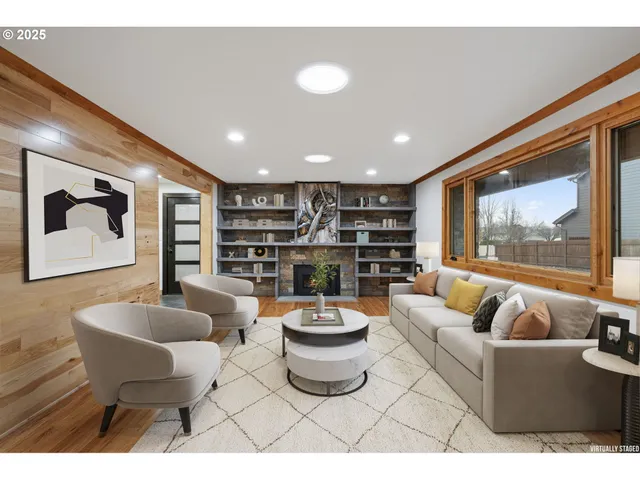 a living room with furniture and a painting