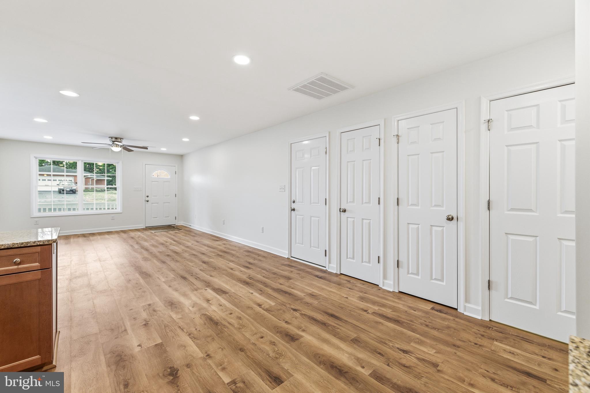 103 6th Avenue Luray, VA 22835 - Photo 13 of 58 a view of an empty room with wooden floor and a window