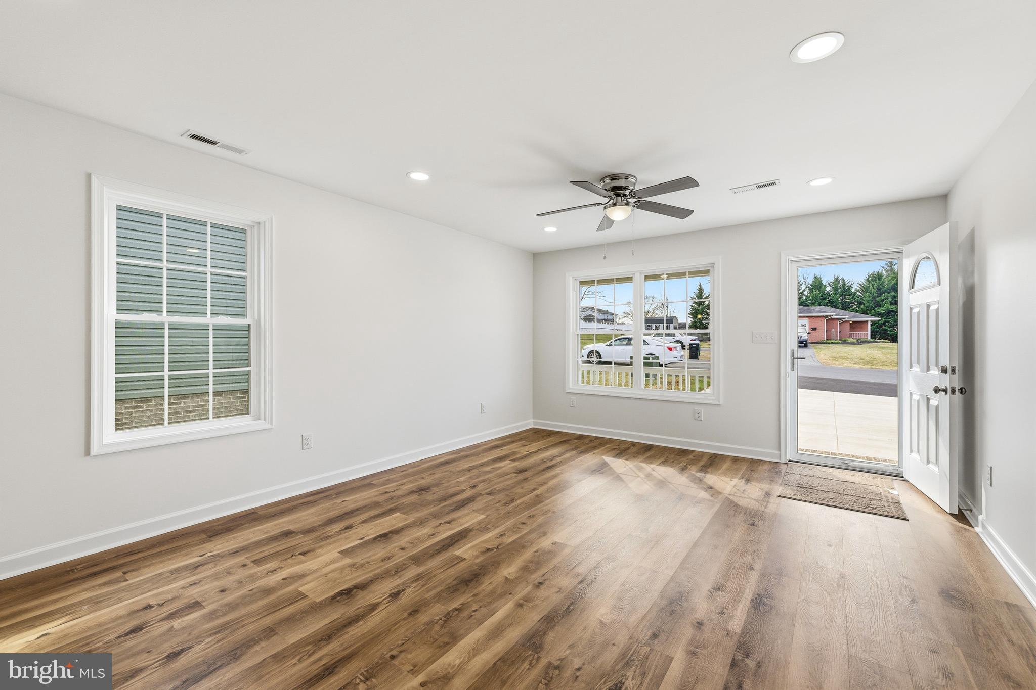 103 6th Avenue Luray, VA 22835 - Photo 14 of 58 a view of an empty room with a window and a kitchen
