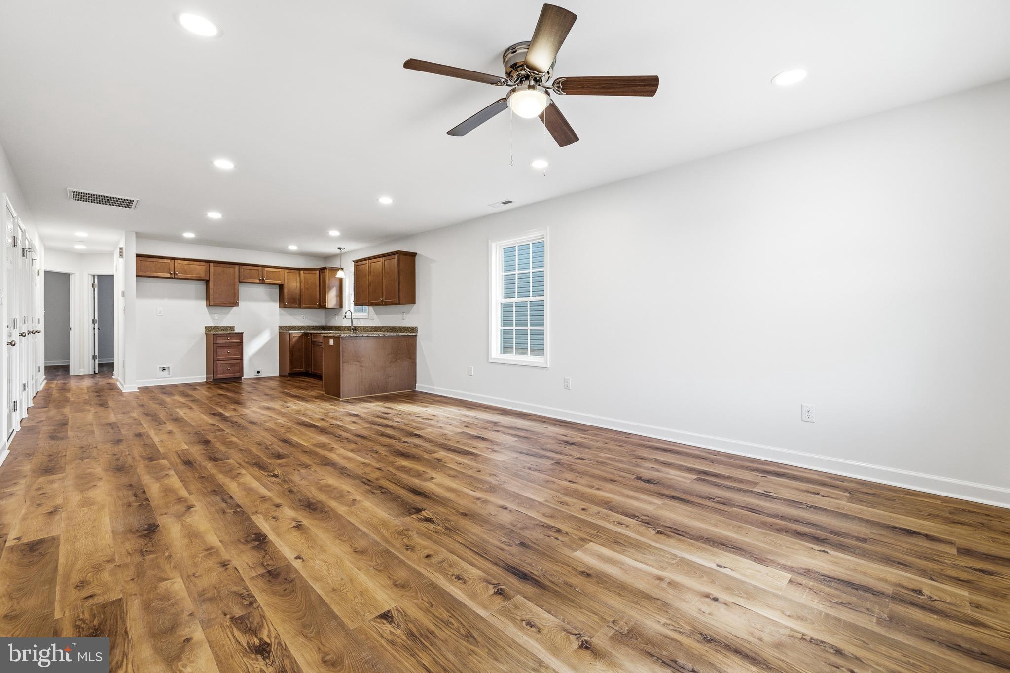 103 6th Avenue Luray, VA 22835 - Photo 5 of 58 a view of empty room with wooden floor and fan
