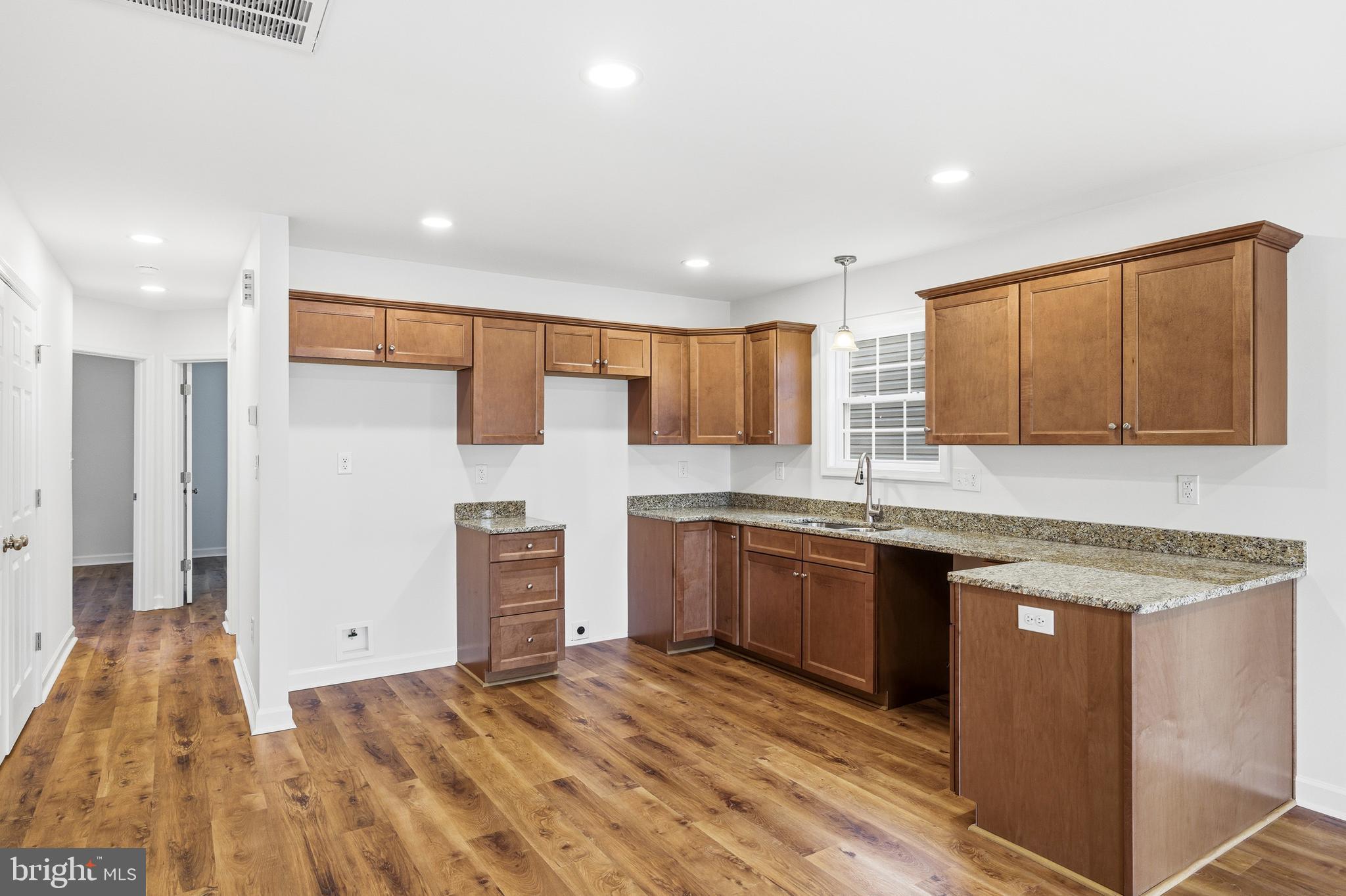 103 6th Avenue Luray, VA 22835 - Photo 6 of 58 a kitchen with stainless steel appliances granite countertop a stove a sink and a refrigerator