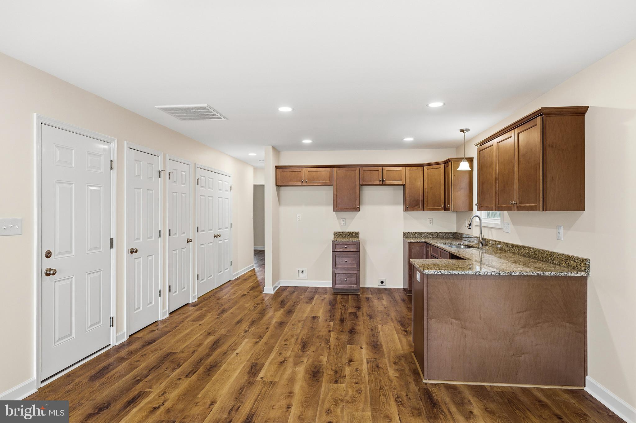 103 6th Avenue Luray, VA 22835 - Photo 7 of 58 a kitchen with stainless steel appliances granite countertop a sink and cabinets