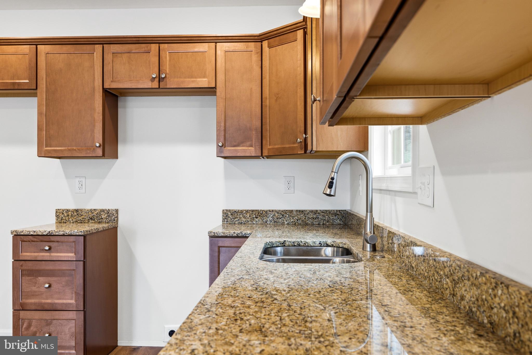 103 6th Avenue Luray, VA 22835 - Photo 9 of 58 a kitchen with a refrigerator and a sink