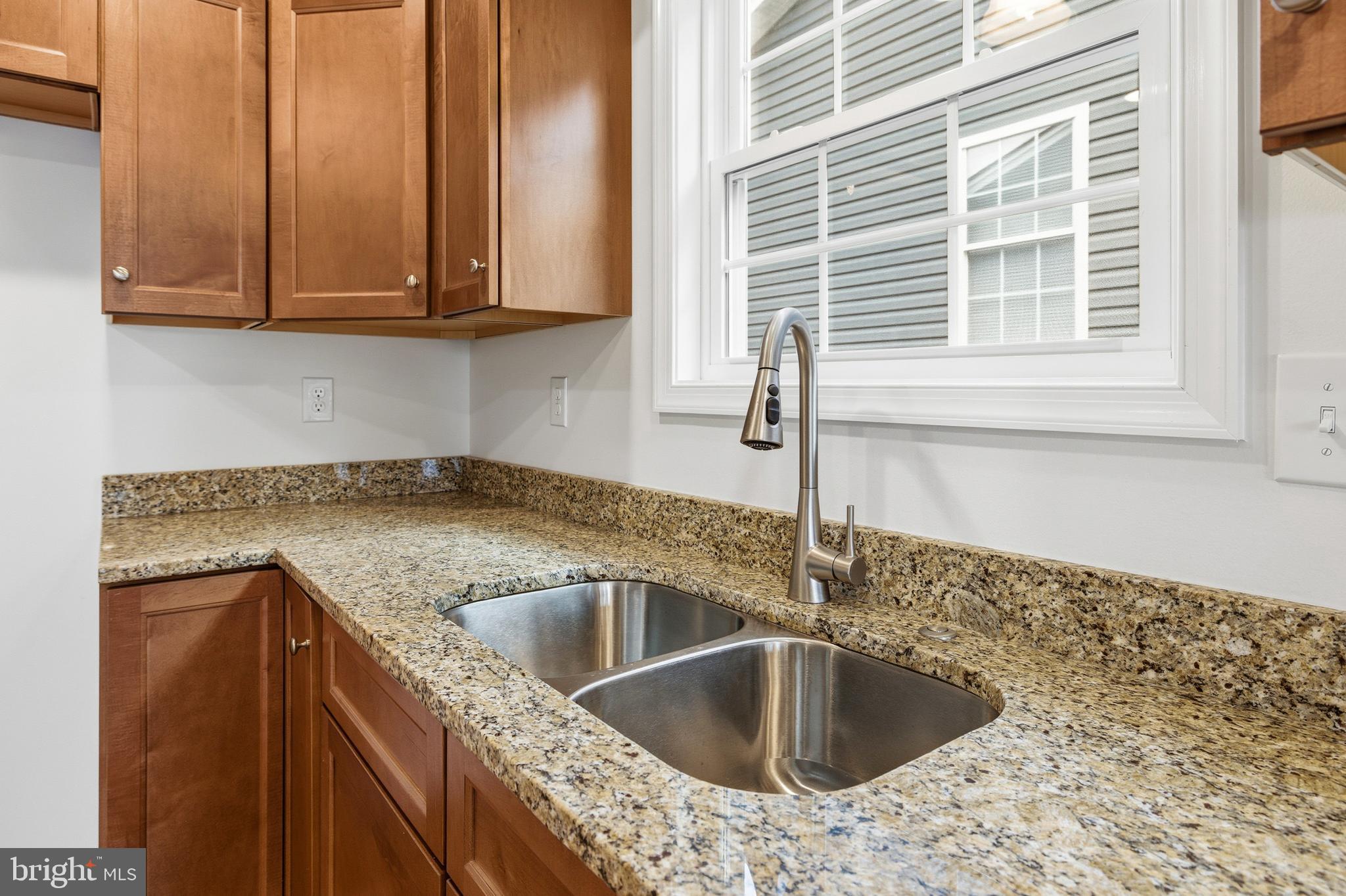 103 6th Avenue Luray, VA 22835 - Photo 10 of 58 a kitchen with granite countertop a sink and a window