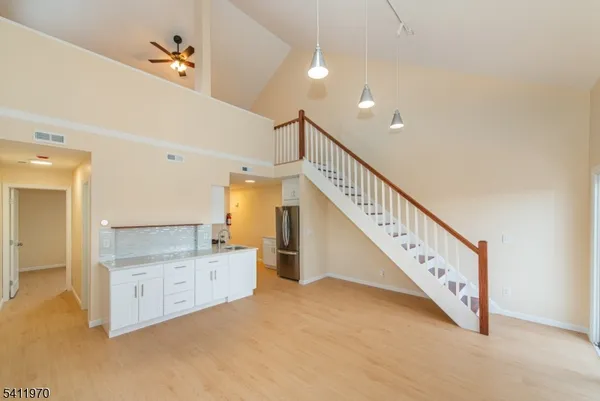 a view of a hallway with staircase