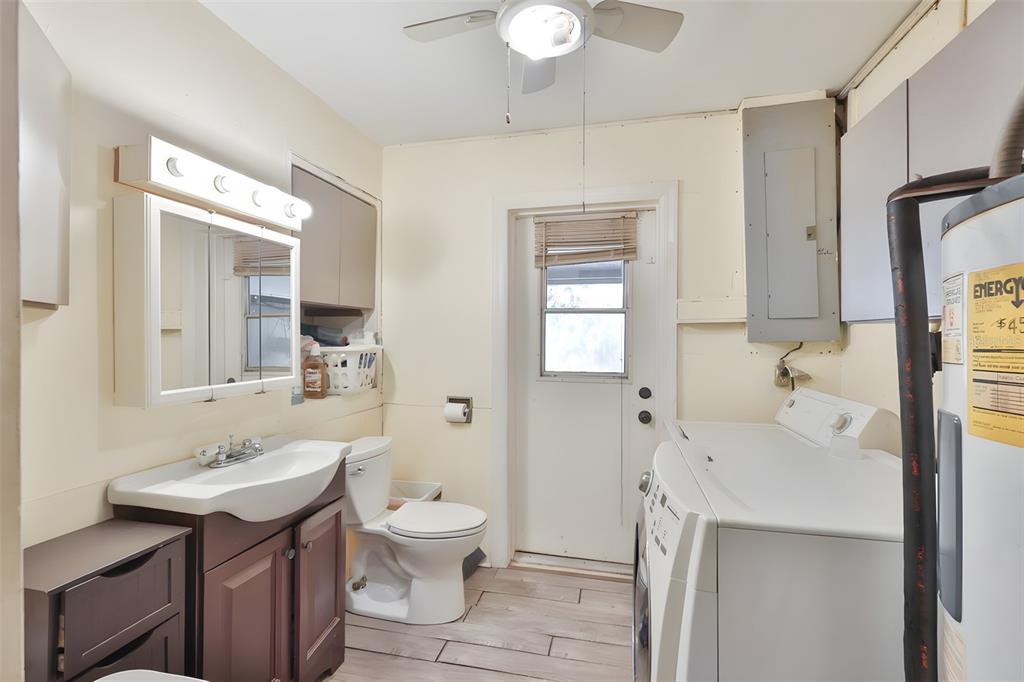 14451 Highland Road Wimauma, FL 33598 - Photo 67 of 80 a bathroom with a sink a toilet and shower