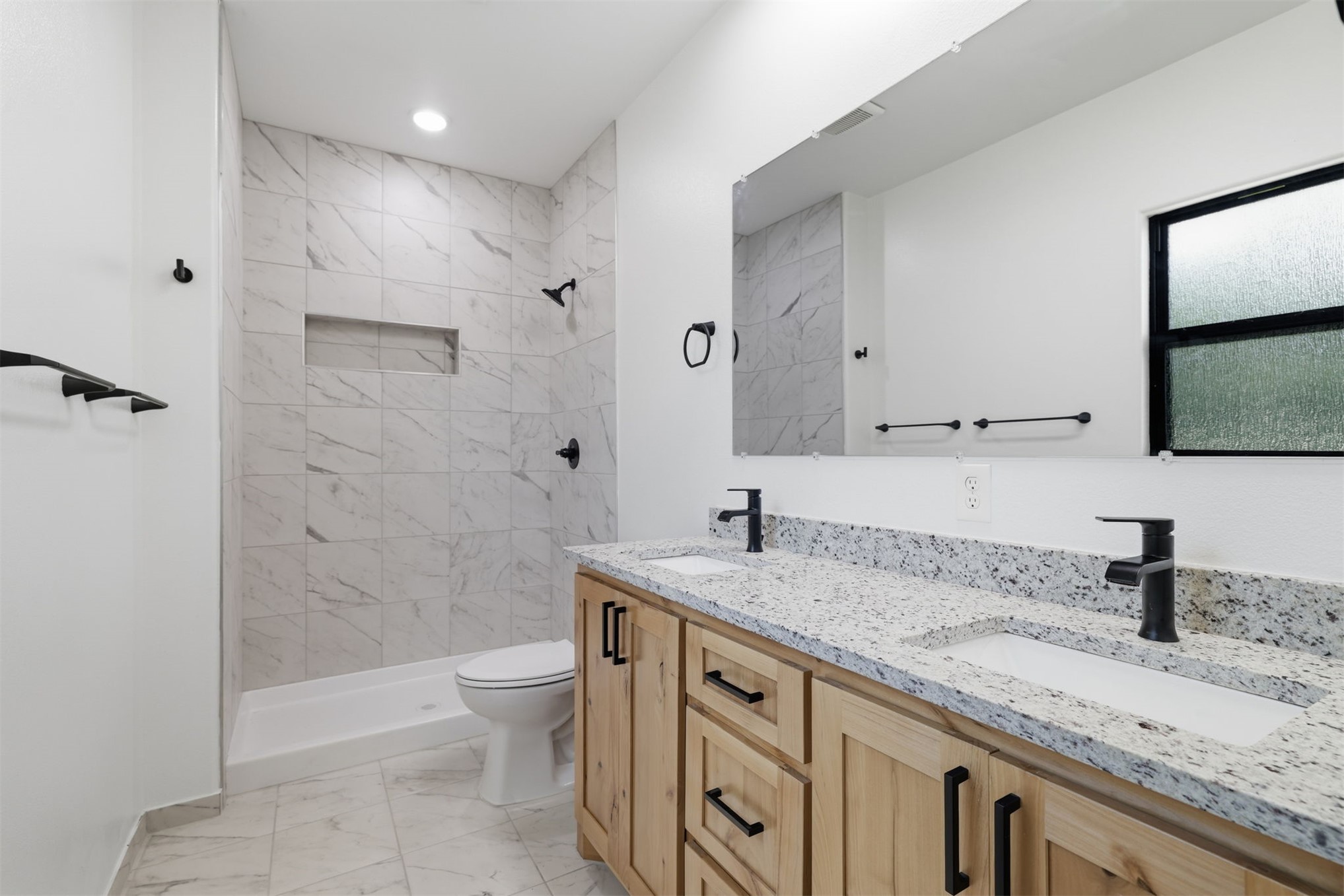 63 Deerfield Road Colbert, OK 74733 - Photo 16 of 33 Modern bathroom featuring a dual vanity with light wood cabinetry and granite-finish countertops