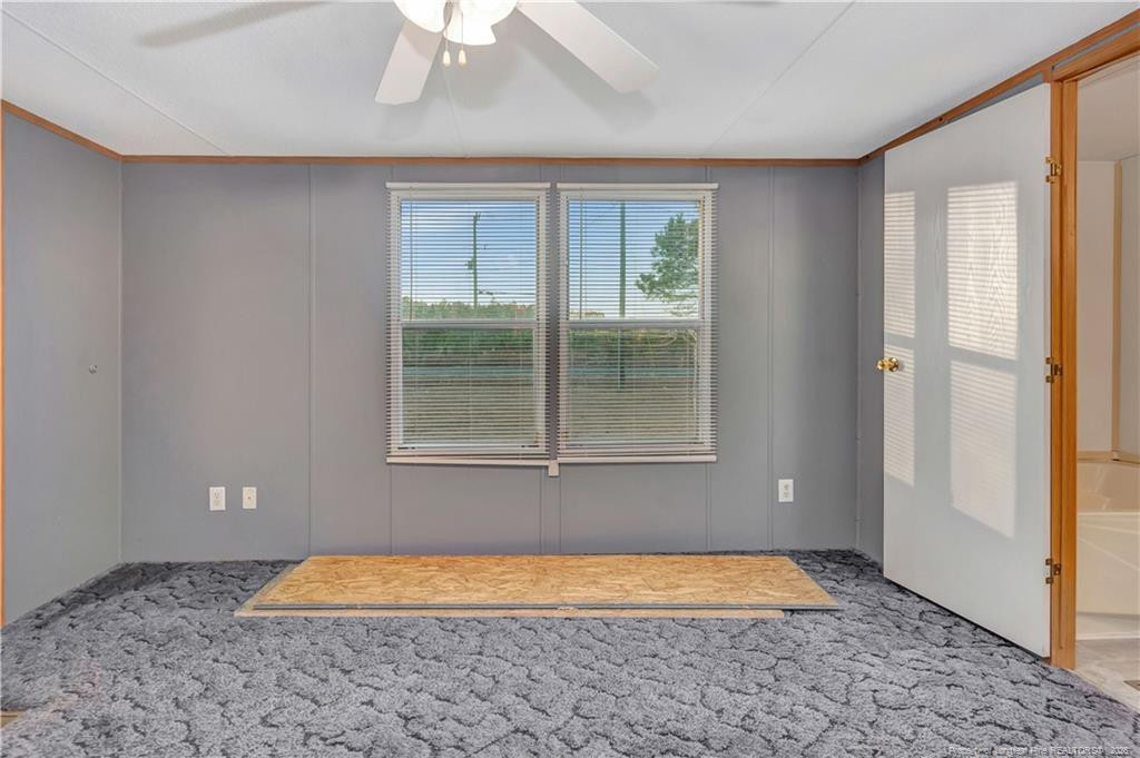 6459 Wire Grass Road Orrum, NC 28369 - Photo 11 of 22 a view of a room with window