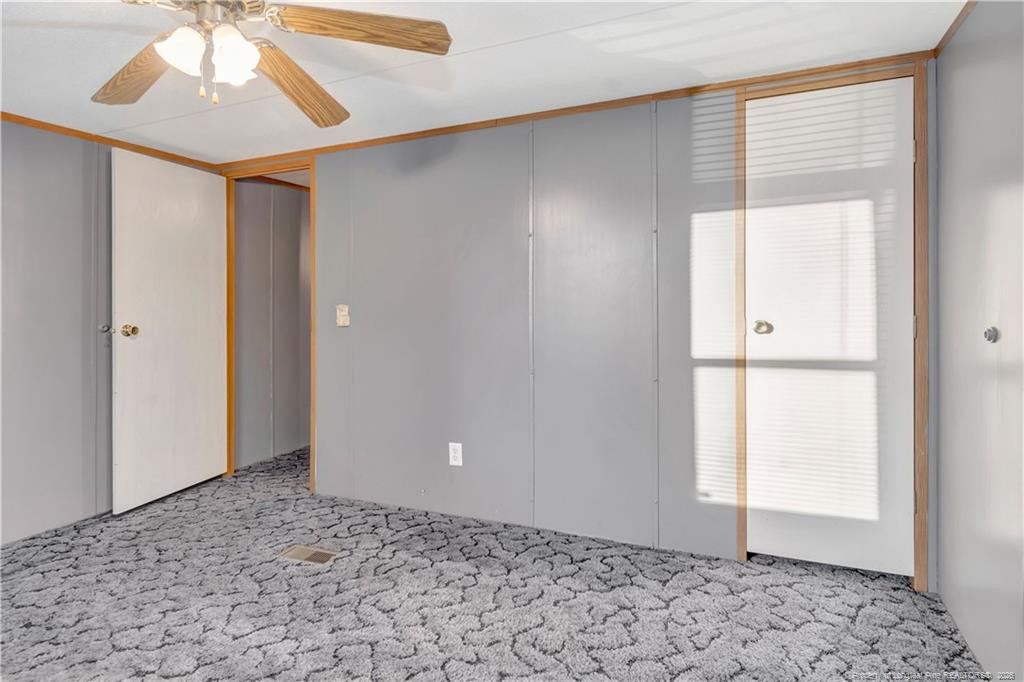 6459 Wire Grass Road Orrum, NC 28369 - Photo 18 of 22 a view of an empty room and window