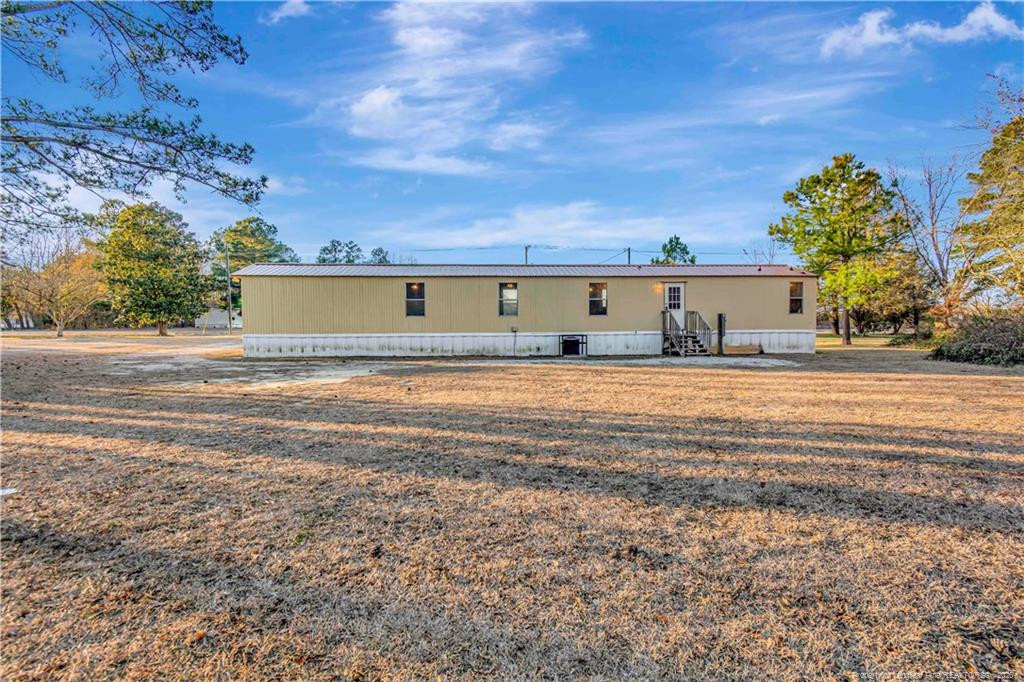 6459 Wire Grass Road Orrum, NC 28369 - Photo 19 of 22 a view of ocean with a big yard