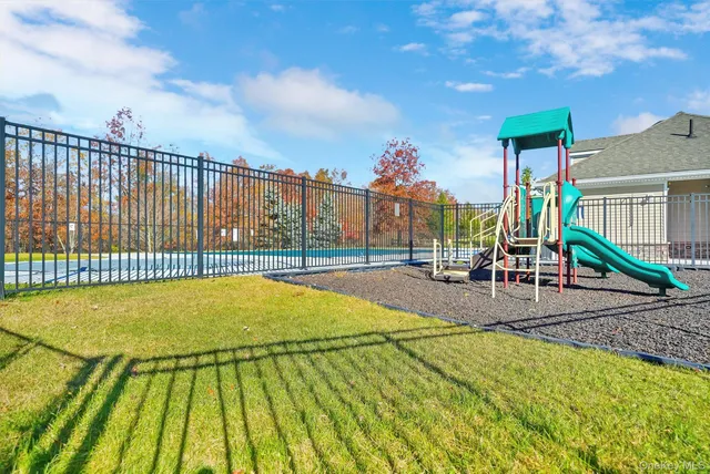 a view of a swimming pool with a slide