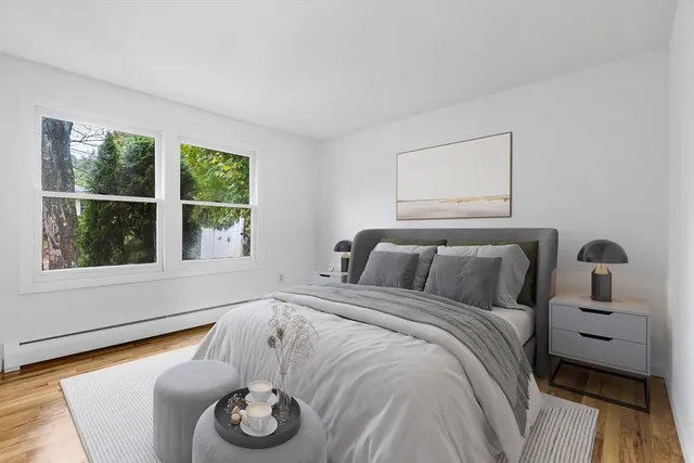 a bedroom with a bed and a window with outer view