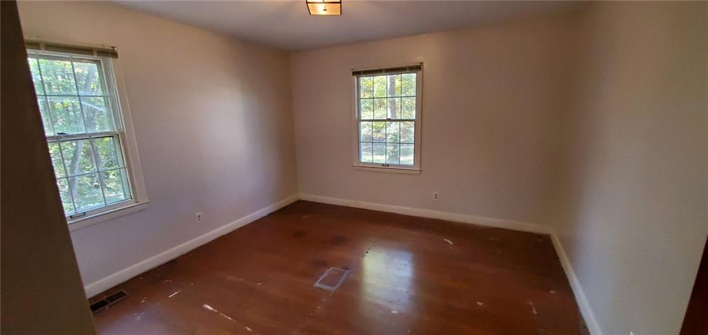 1709 Bethel Road Morganton, NC 28655 - Photo 16 of 21 an empty room with wooden floor and windows