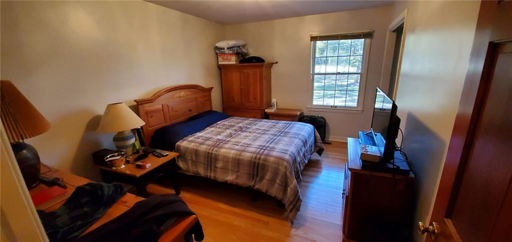 1709 Bethel Road Morganton, NC 28655 - Photo 17 of 21 a bedroom with a bed and wooden floor