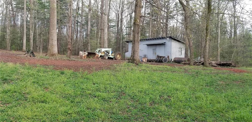 1709 Bethel Road Morganton, NC 28655 - Photo 21 of 21 a backyard of a house with table and chairs