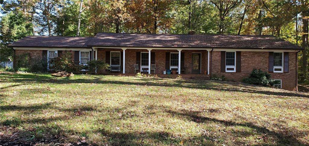 1709 Bethel Road Morganton, NC 28655 - Photo 5 of 21 a front view of a house with outdoor seating