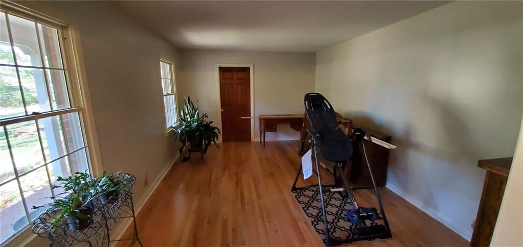 1709 Bethel Road Morganton, NC 28655 - Photo 7 of 21 a view of a hallway with wooden floor and stairs