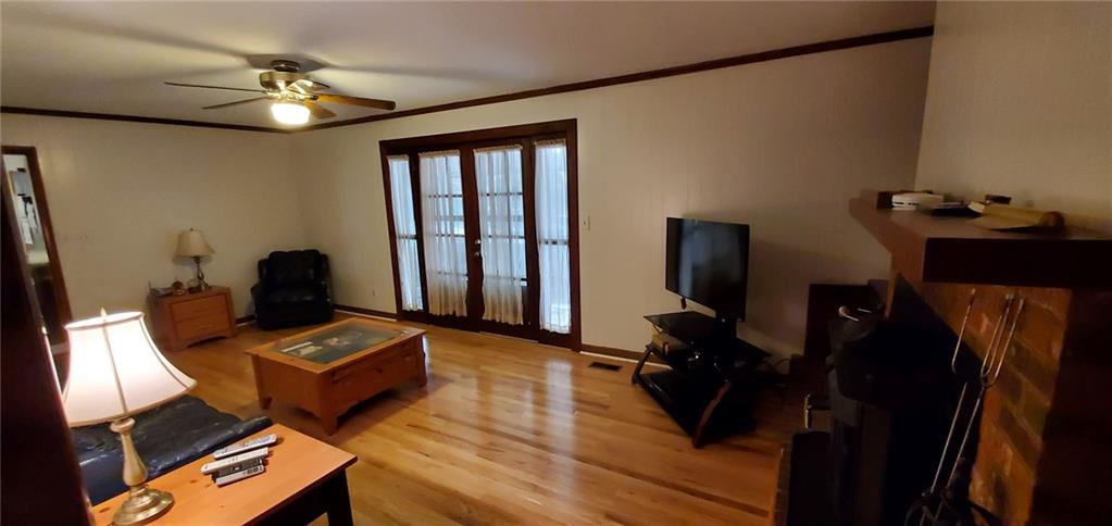 1709 Bethel Road Morganton, NC 28655 - Photo 8 of 21 a living room with furniture and a flat screen tv